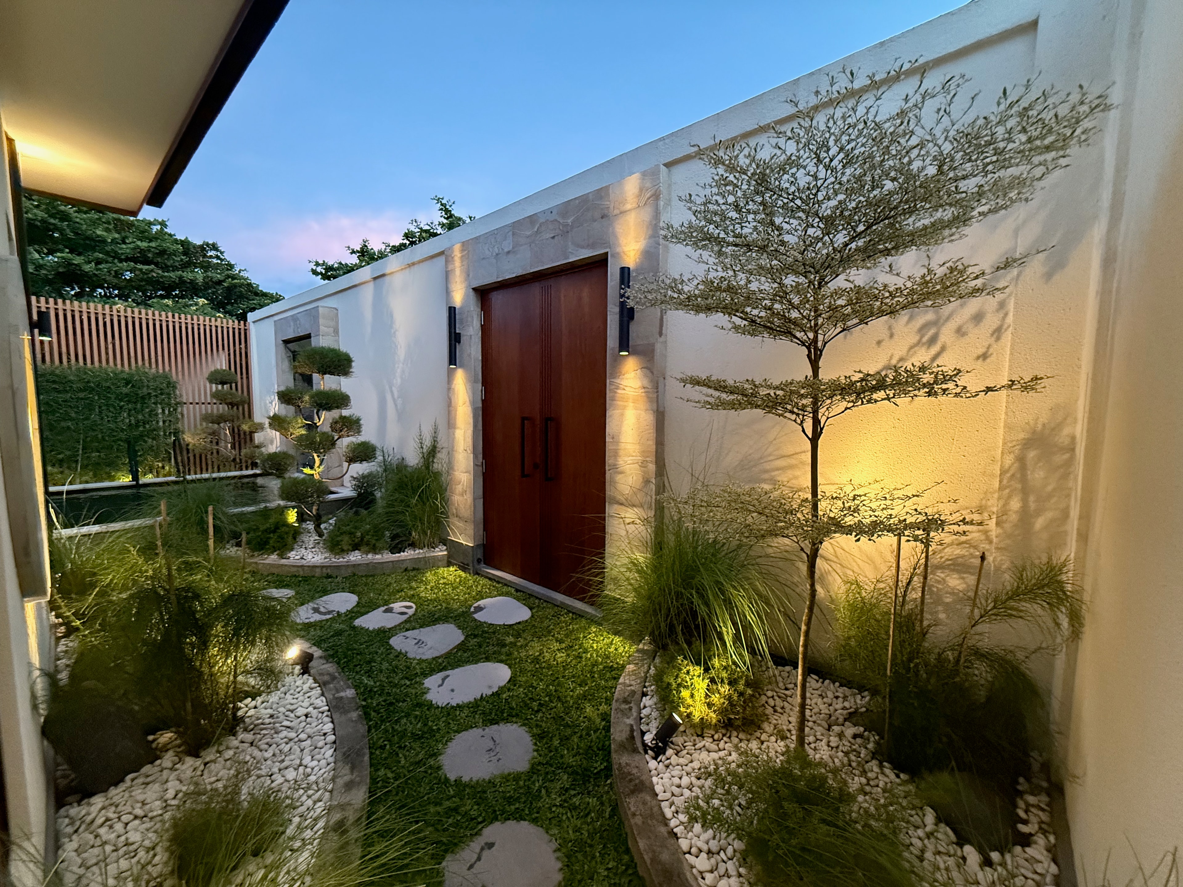 Stepping stones to the door at dusk