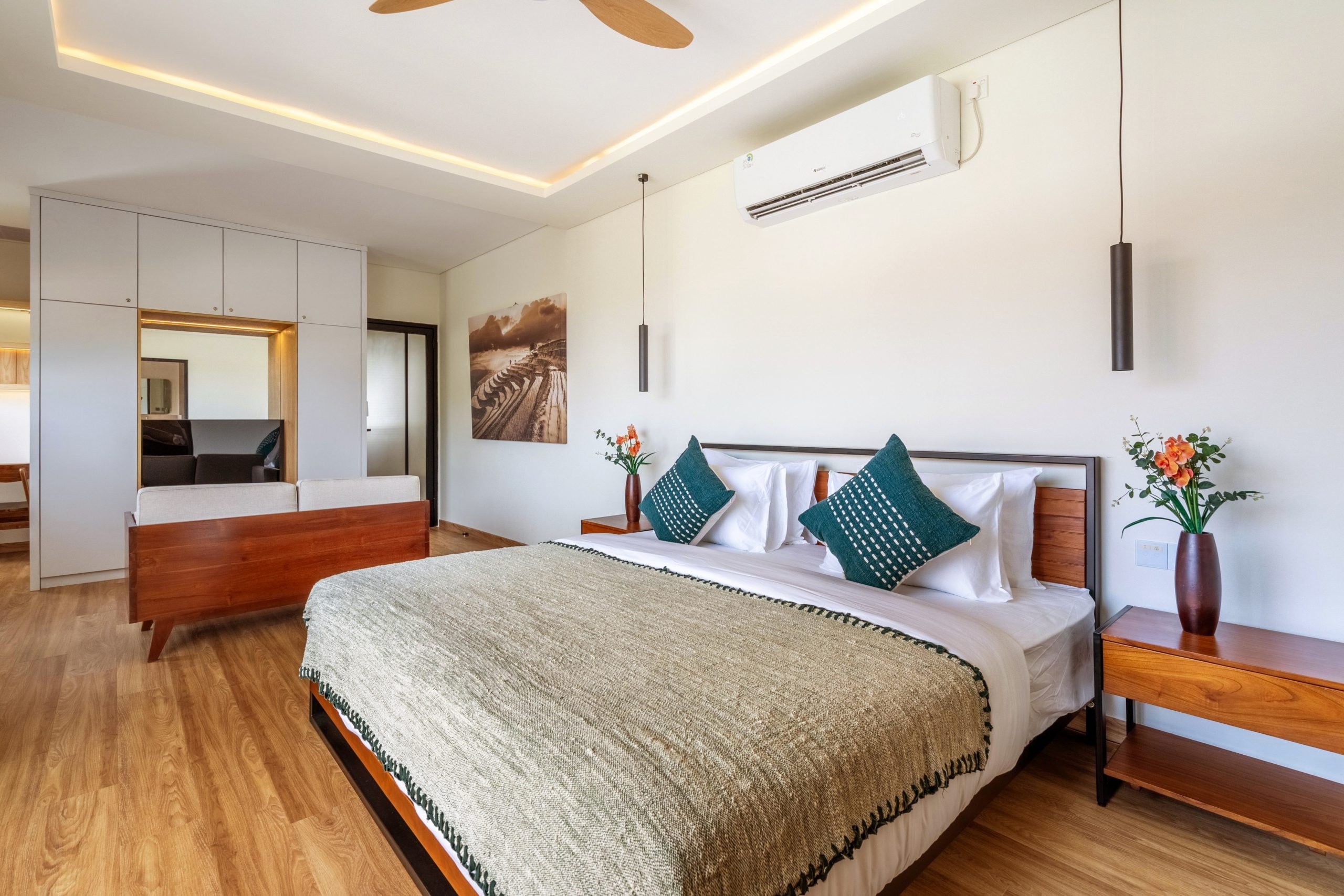 The king-size bed in the master suite, the wardrobe wall behind it