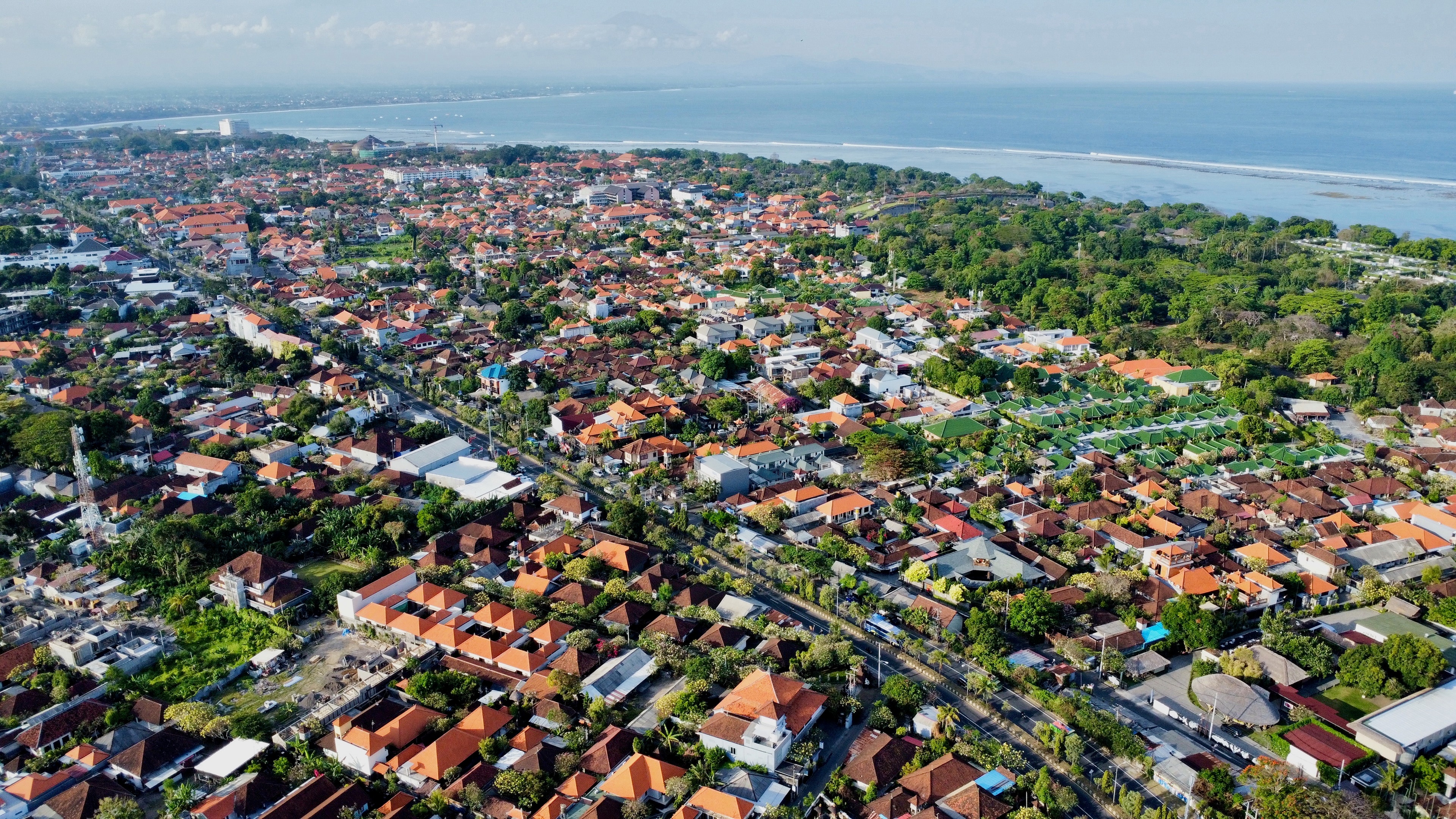 All of Sanur from the air: rooftops, gardens and the reef