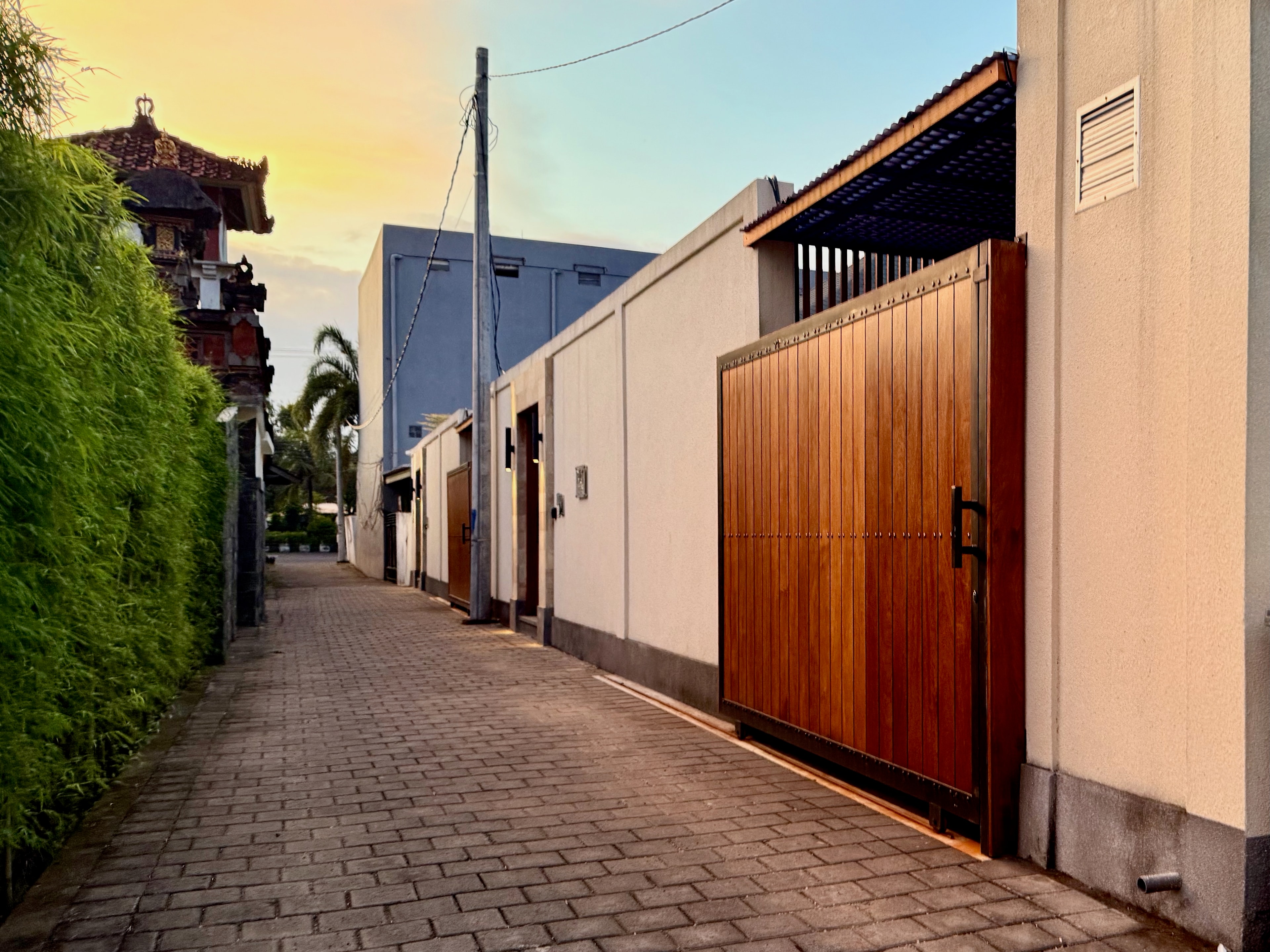 The quiet lane leading to the villa at dusk